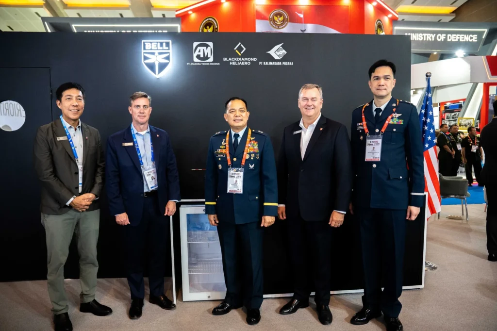 TDR FILMS crew with the Bell Textron team at the IndoDefence trade show booth in Jakarta