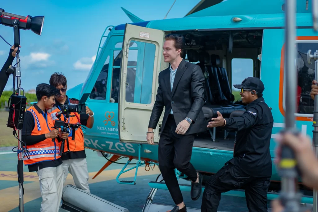 TDR FILMS crew filming a BTS helicopter arrival scene with talent stepping out, for a DVC production shoot